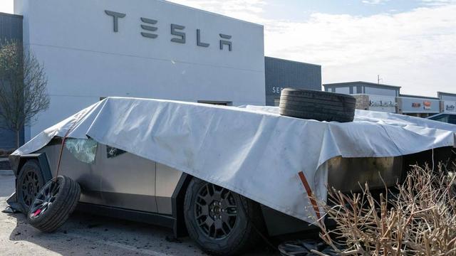 Fire-damaged Tesla Cybertrucks remain covered at a Tesla dealership on Tuesday, March 18, 2025, in Kansas City. Fire crews responded to the dealership at 10111 State Line Road late Monday night to extinguish the blaze. The cause of the fire is under investigation by bomb and arson authorities. Emily Curiel ecuriel@kcstar.com